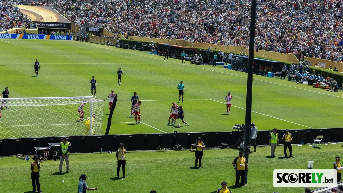 Soccer match in a crowded stadium with players near the goal (file photo)