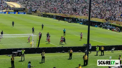Soccer match in a crowded stadium with players near the goal (file photo)